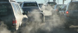 Polluting clouds of exhaust fumes rise in the air